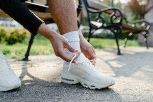 Improve function and coordination by tying a shoe